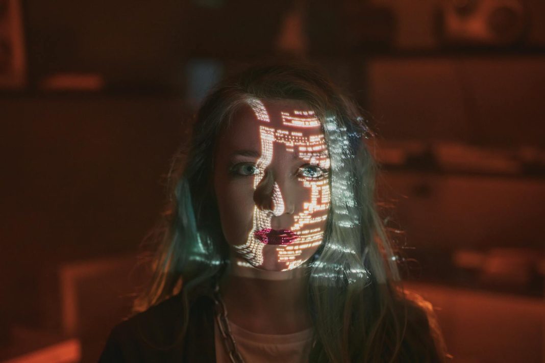 A Woman with Green Hair Looking at the Camera