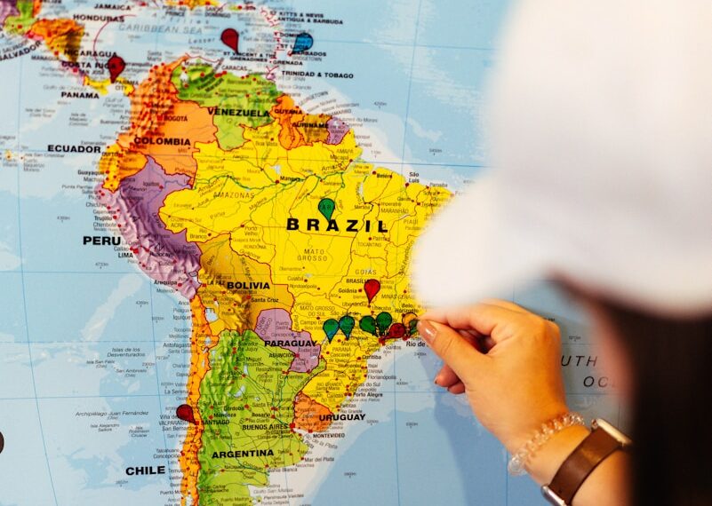 Someone points to a map of south america.