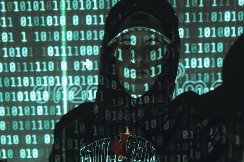 man in black hoodie wearing black framed eyeglasses