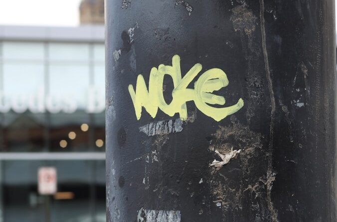 a close up of a pole with some stickers on it