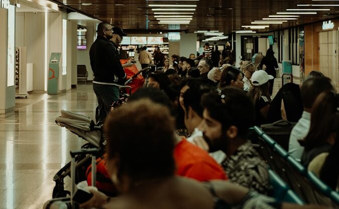a group of people sitting in a waiting area