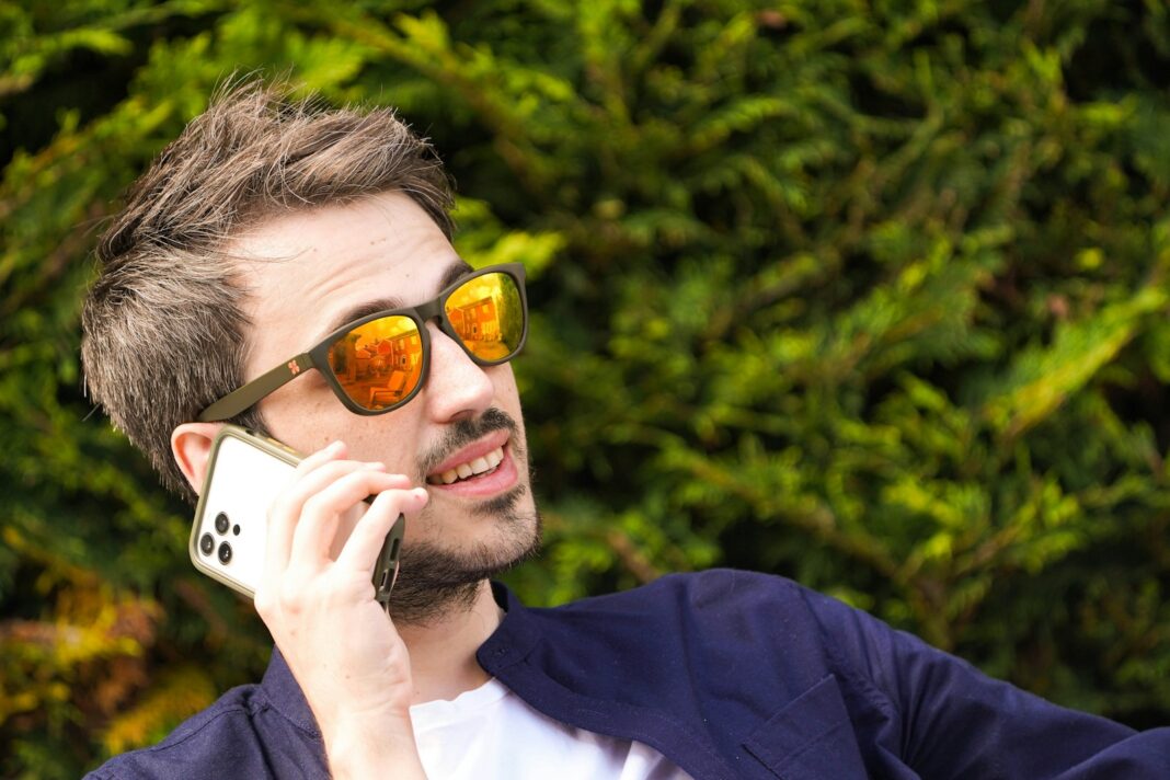 a man talking on a cell phone