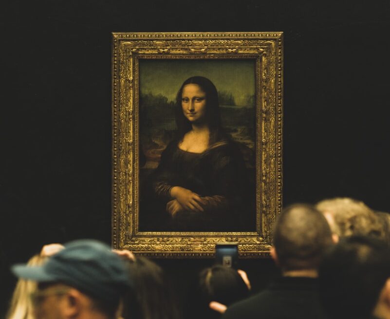 man in white hat and black shirt painting