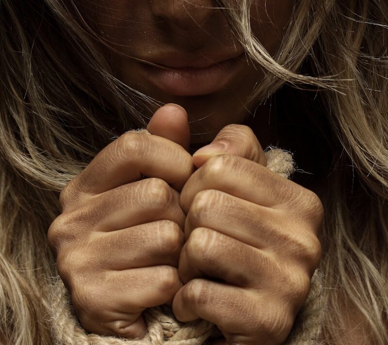 woman with hands tied