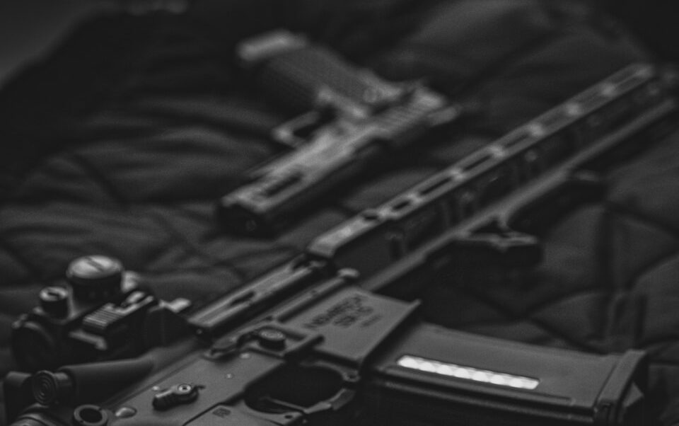 black semi automatic pistol on black textile