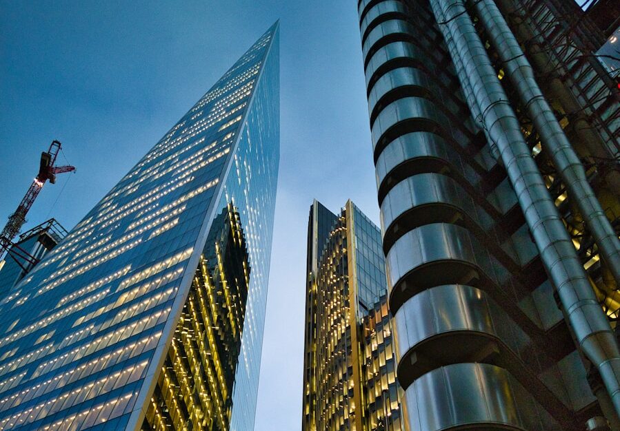 a couple of tall buildings sitting next to each other