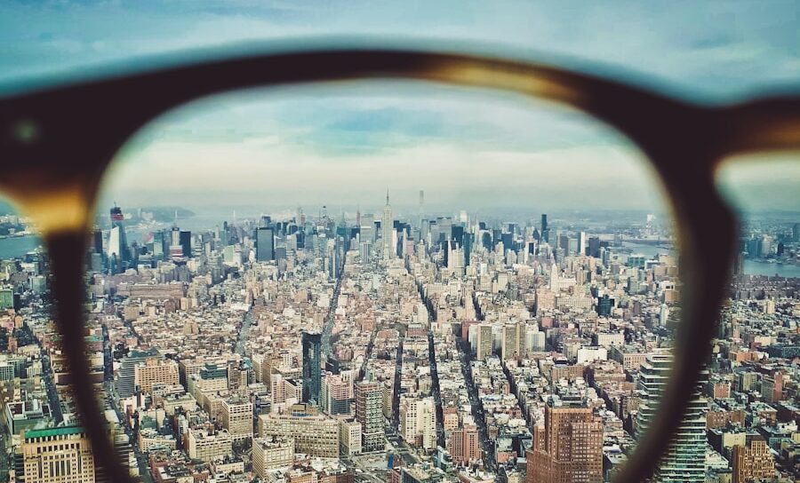 city buildings on eyeglasses view