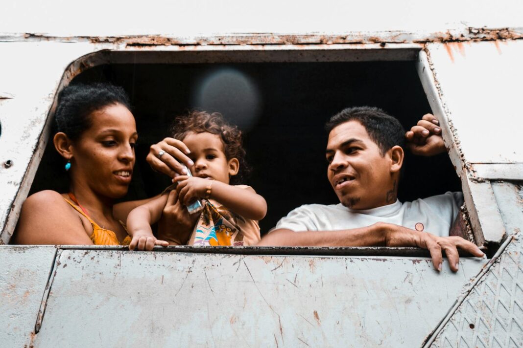Happy family looking out a window, capturing a moment of connection and joy.