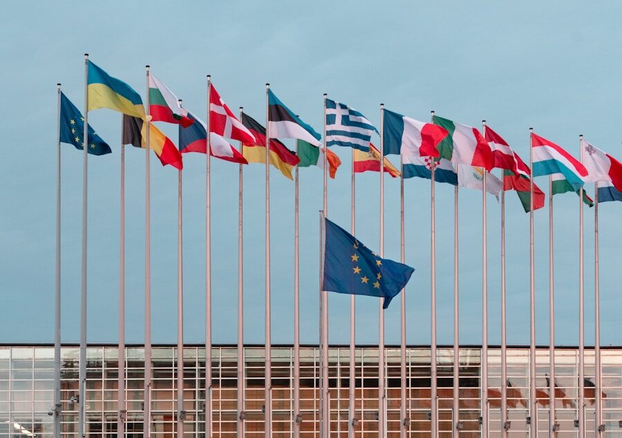 a bunch of flags that are in front of a building