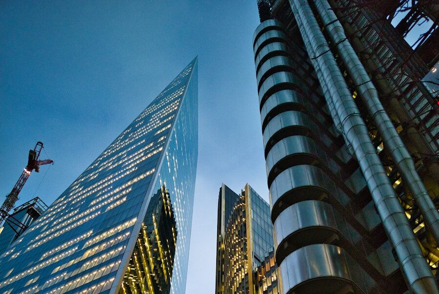 a couple of tall buildings sitting next to each other