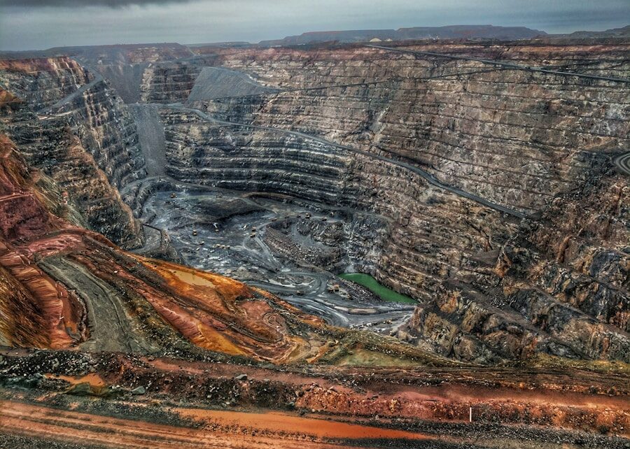 a view of a large open pit in the middle of nowhere