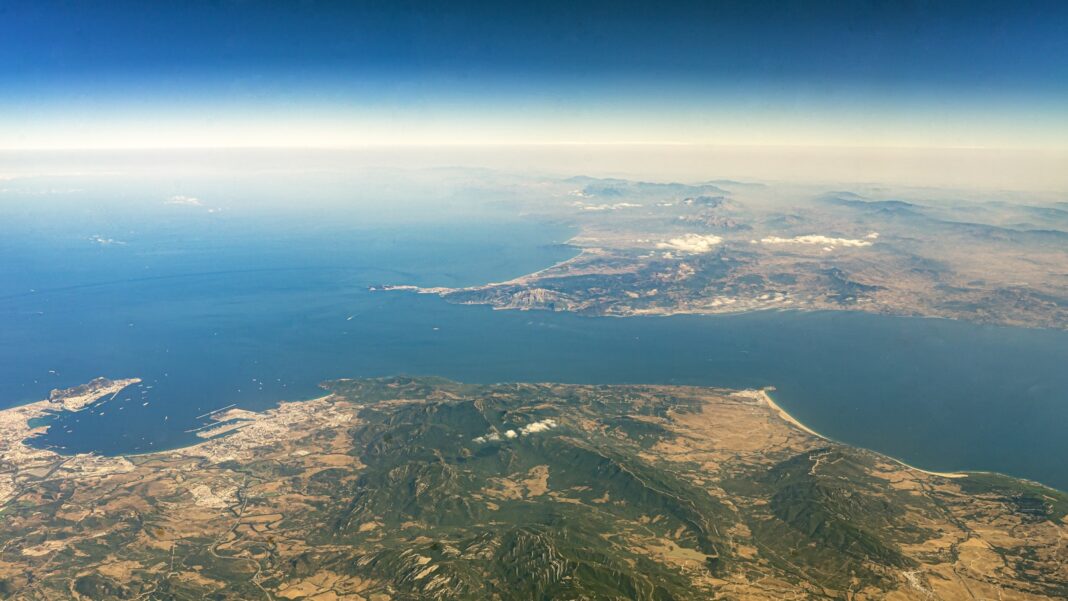 a view of a mountain range and a body of water