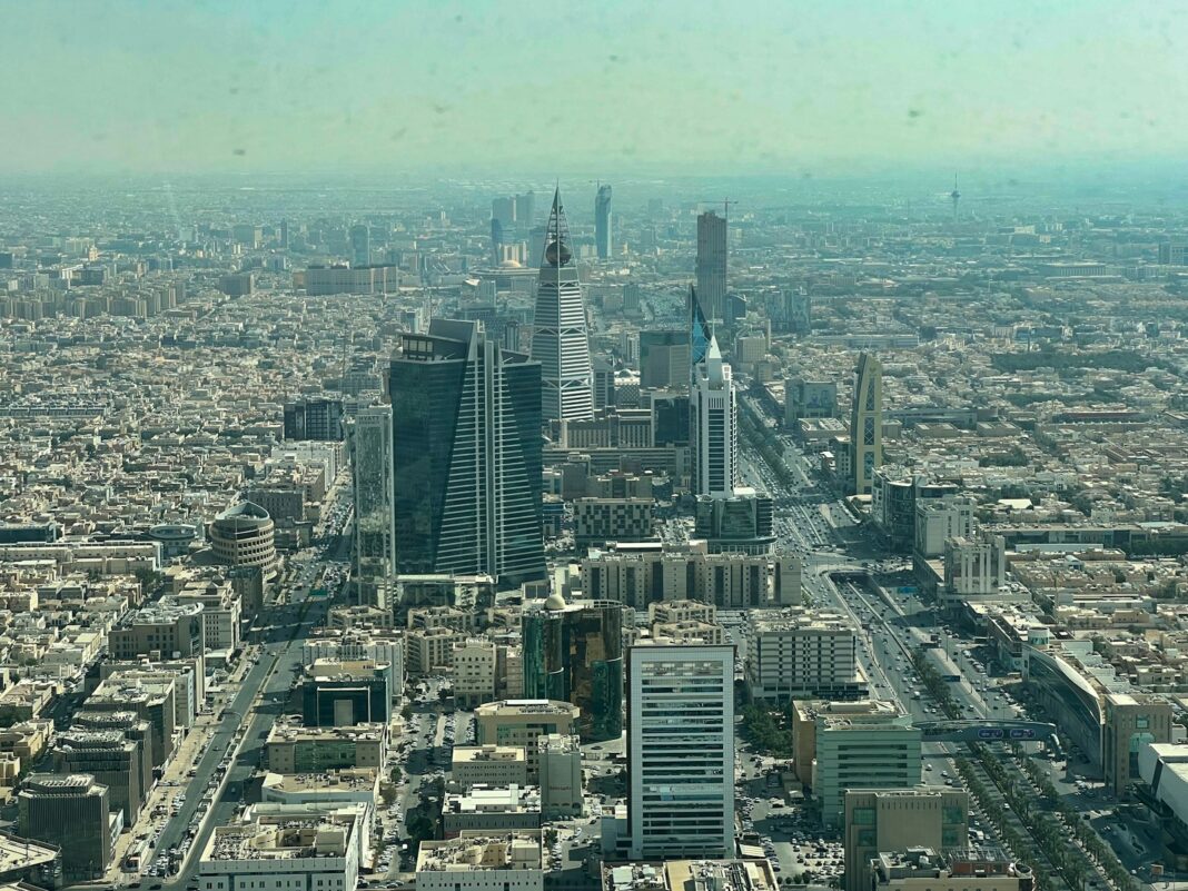 an aerial view of a city with tall buildings