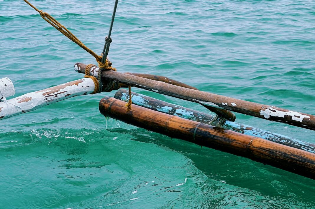 brown wooden stick on body of water