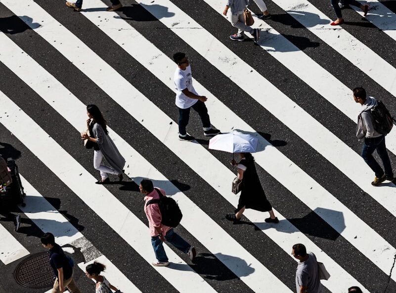 peoples walking on pedestrian lane