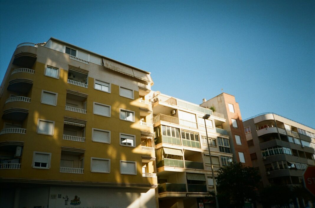 a tall building with balconies and balconies on the top of it