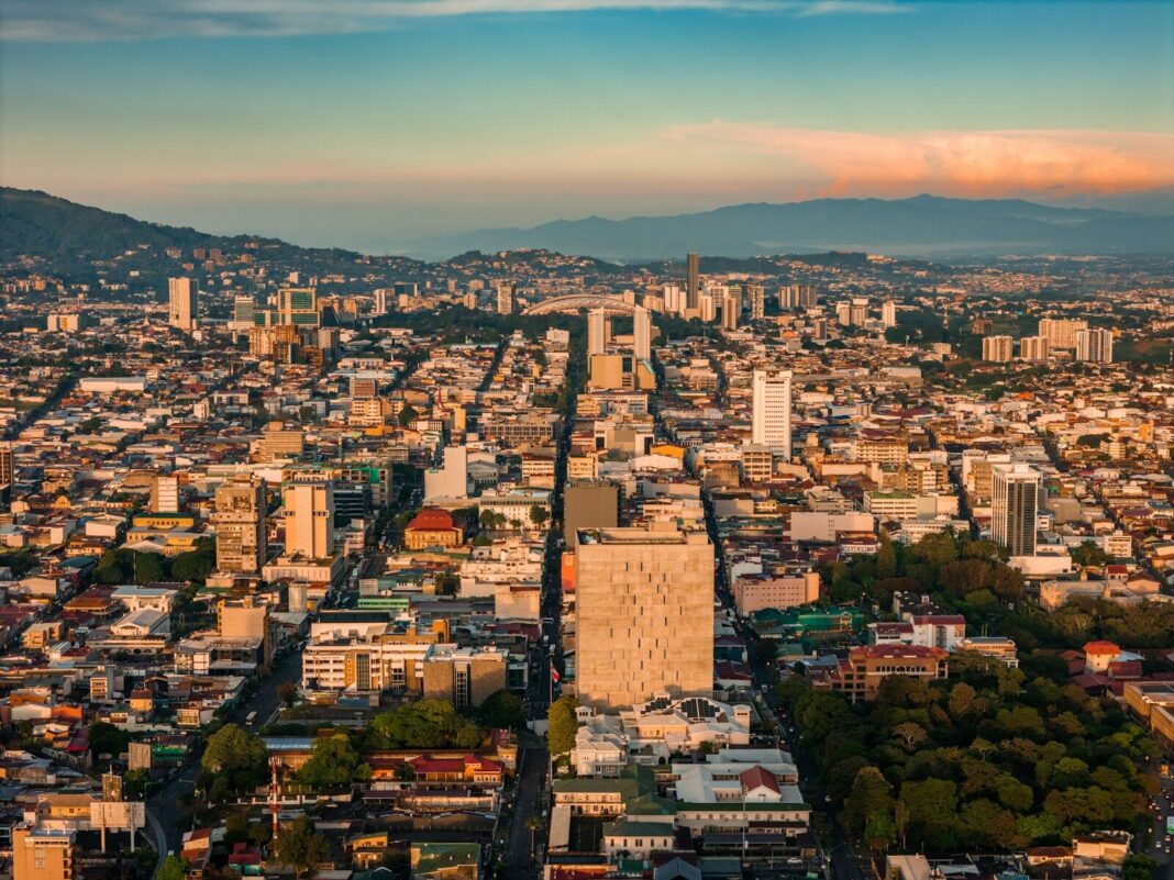 an aerial view of a city with tall buildings