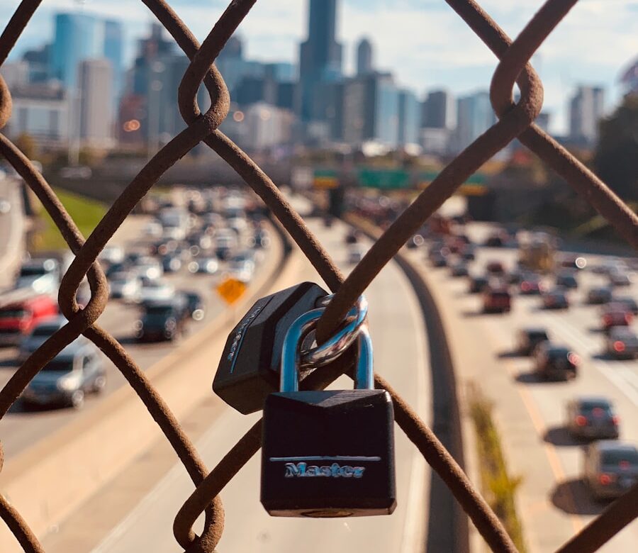 a chain link fence with a padlock attached to it